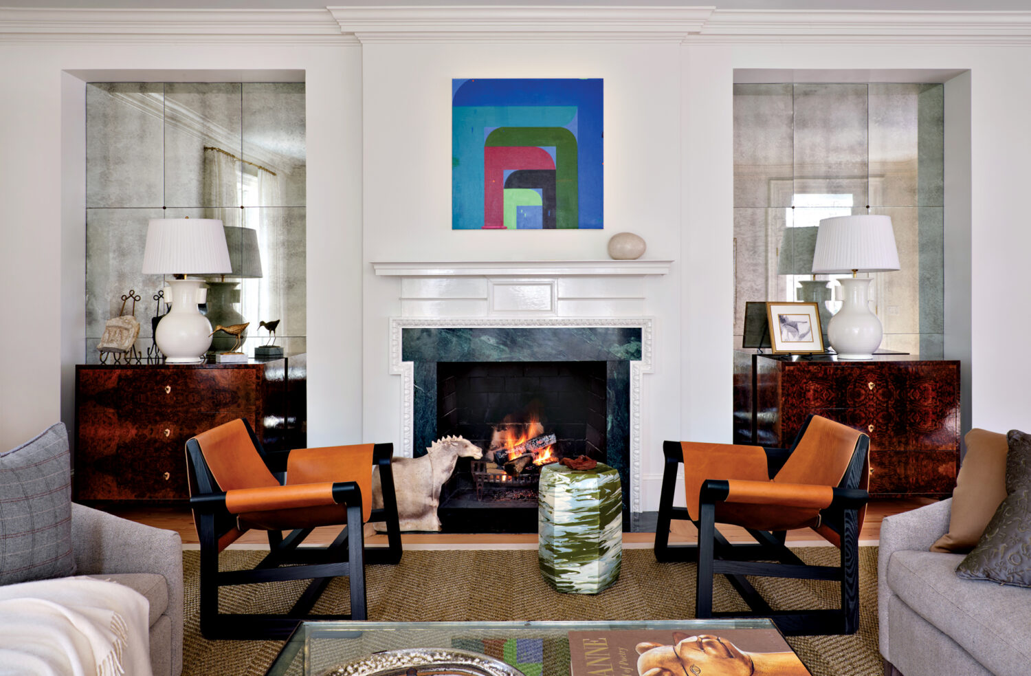 updated living room of a Colonial Revival home with a mix of vintage and modern pieces