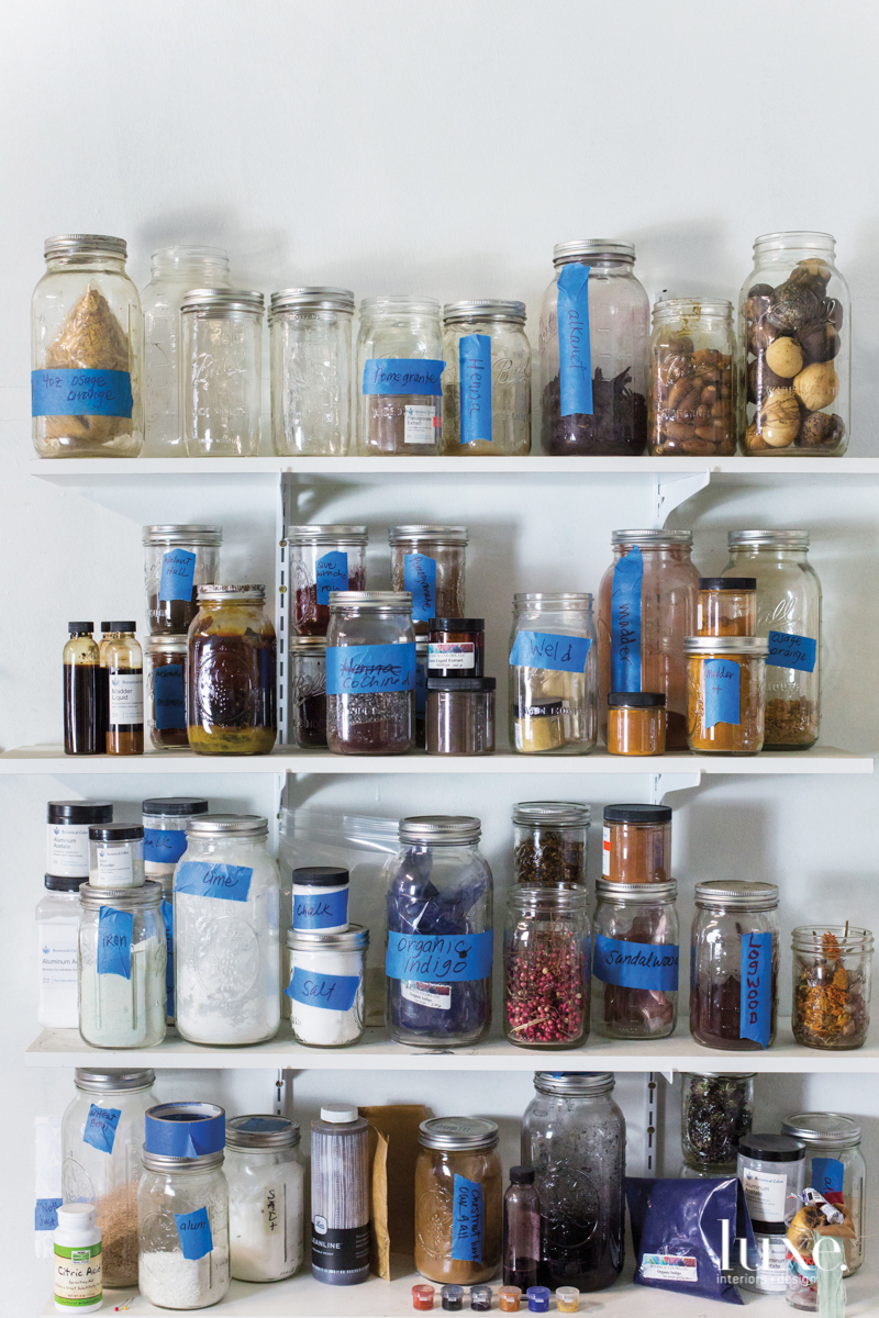 In Crawford's Fairfax studio, blue painter's tape is a fitting accent for mason jars of organic indigo, minerals and other pigments. In Crawford's Fairfax studio, blue painter's tape is a fitting accent for mason jars of organic indigo, minerals and other pigments.