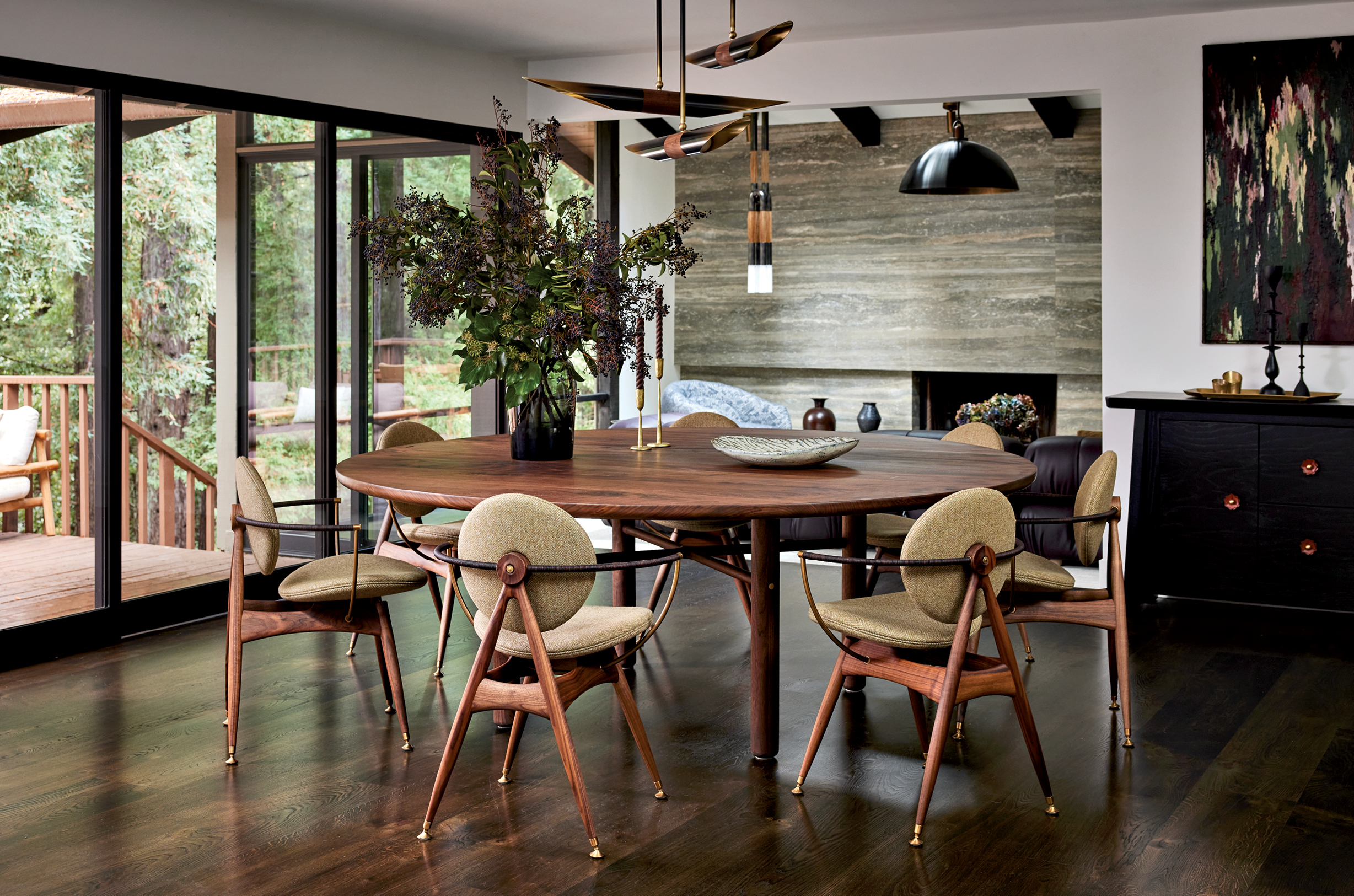 circle dining table with chairs with brass-and-walnut chandelier
