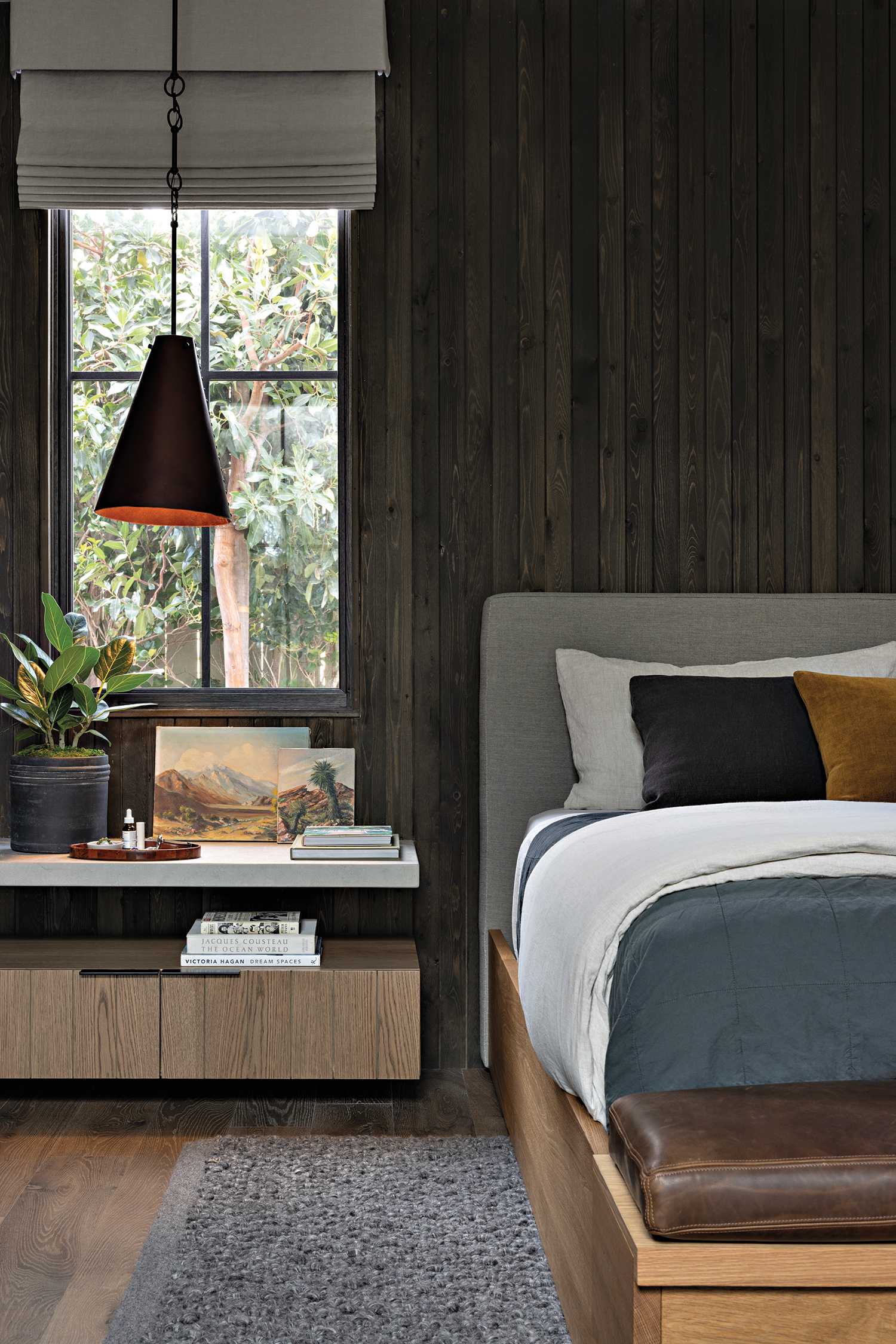 contemporary wood-covered bedroom with a built-in limestone shelf