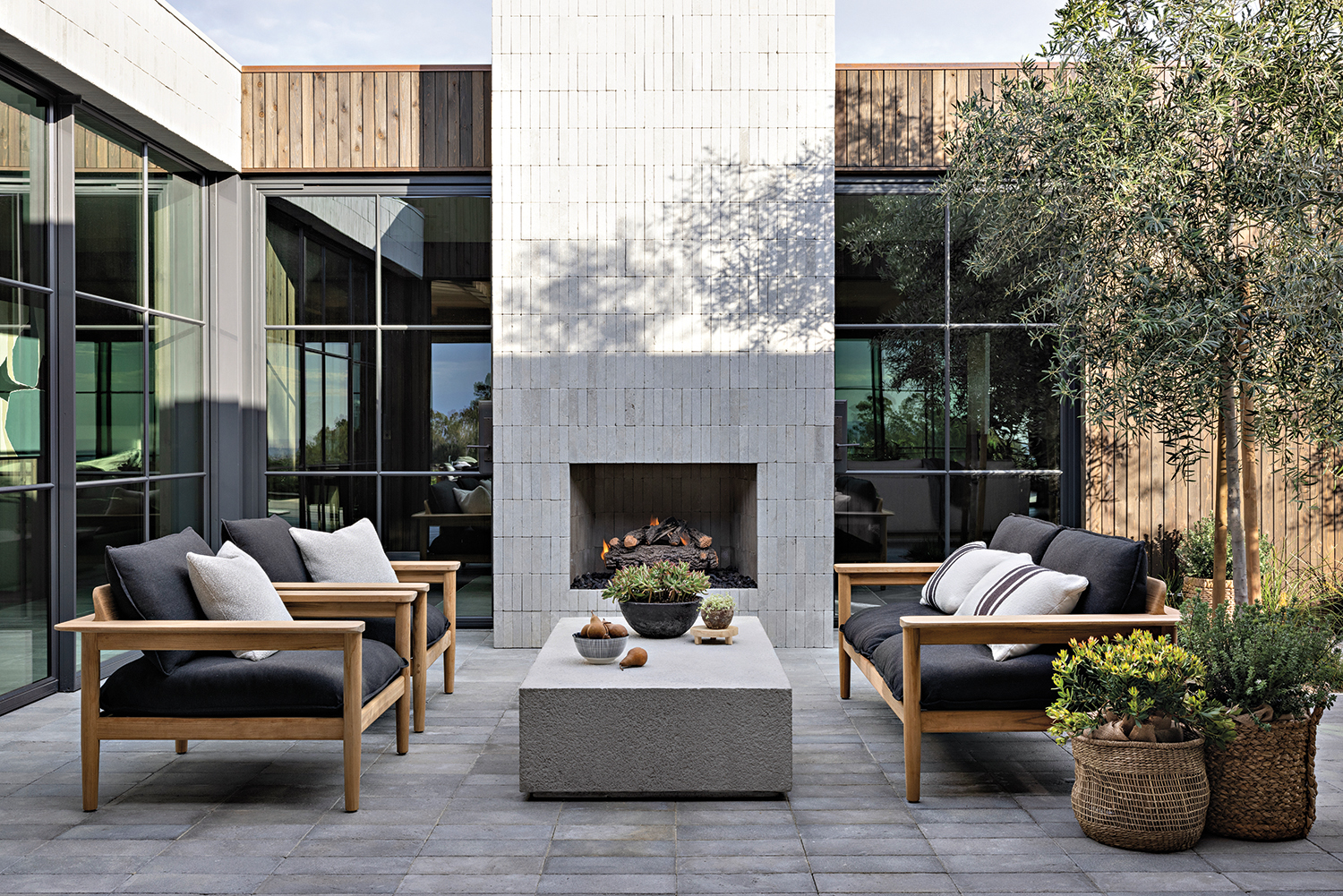 contemporary courtyard with limestone tiles and neutral furnishings