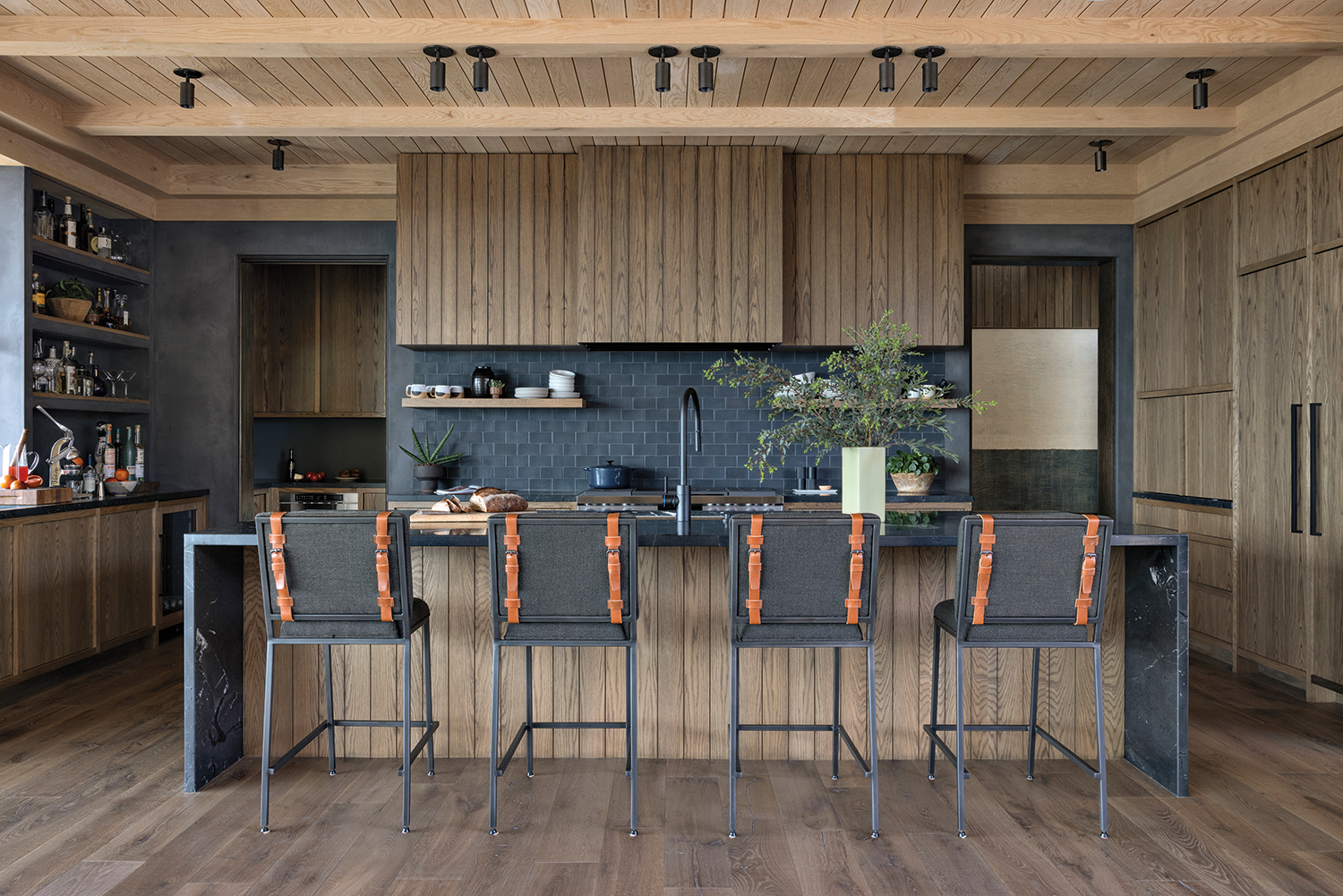 kitchen with matte black backsplash and white oak cabinetry