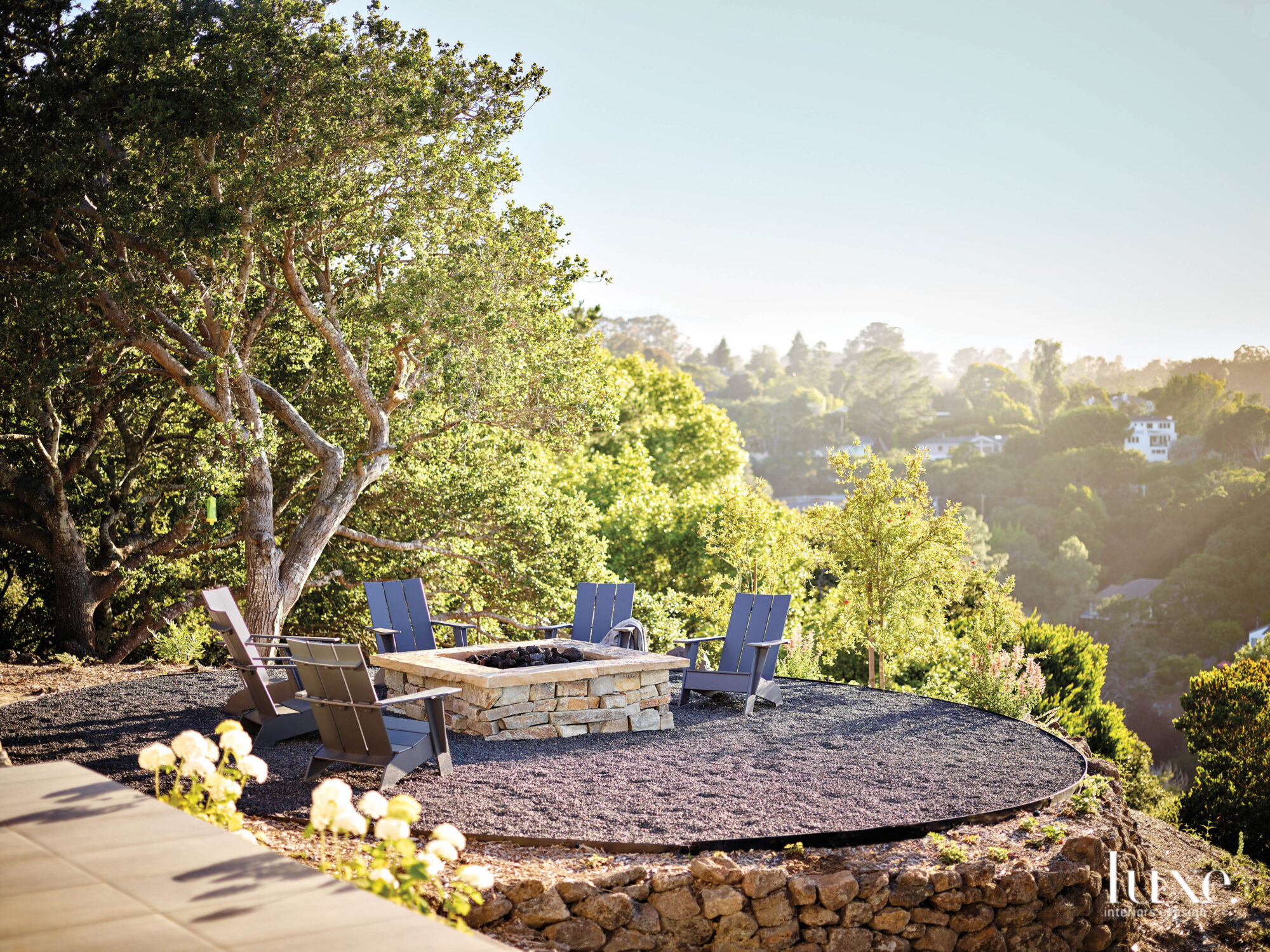 A fire pit area is placed on a hillside