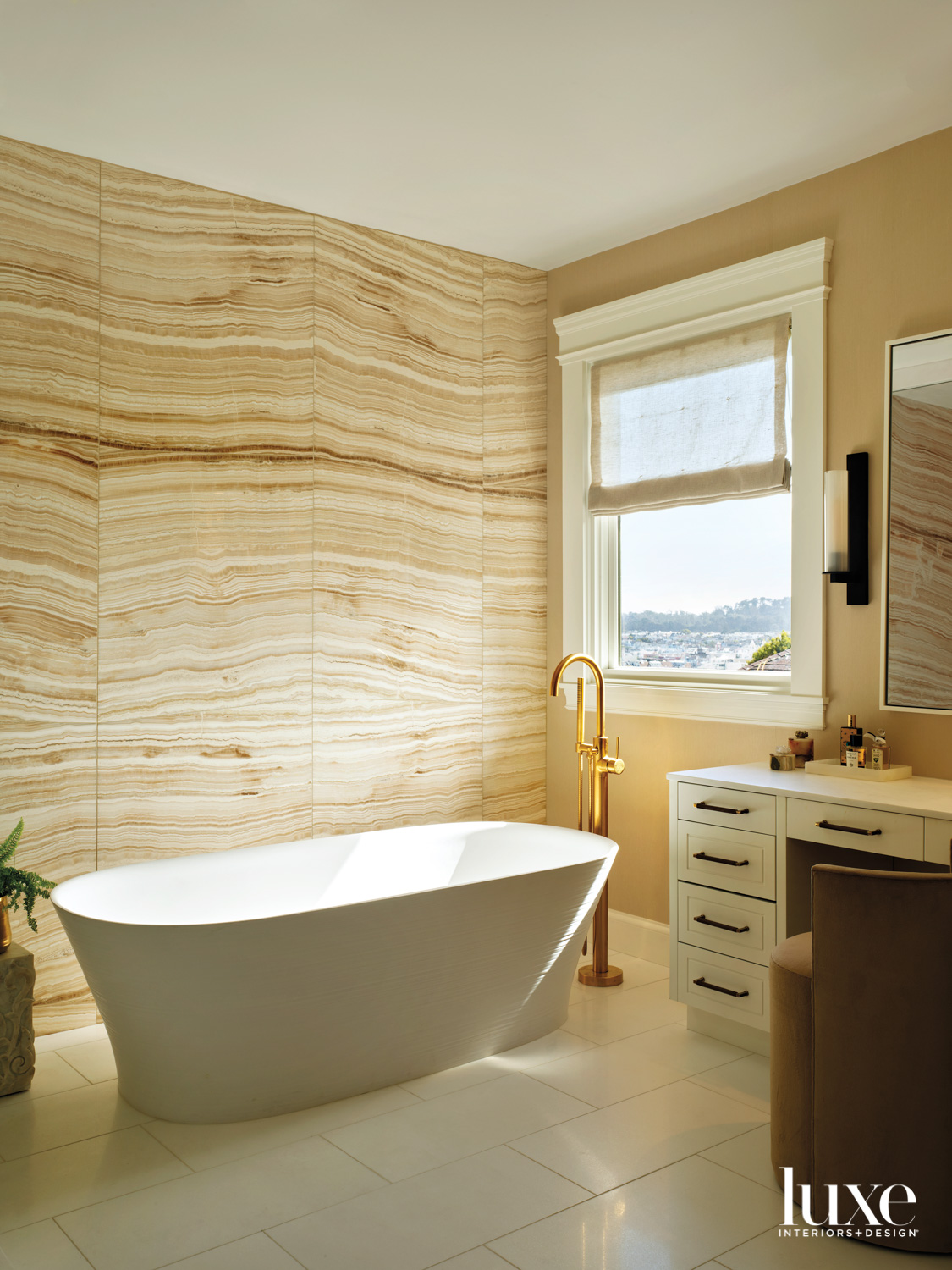A primary bathroom features stone walls with a strong pattern.