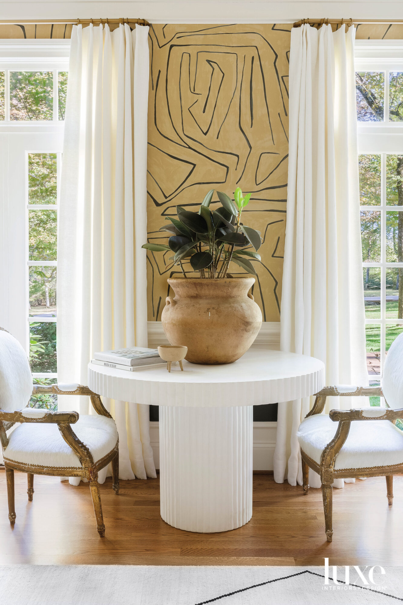 Round table with two antique chairs