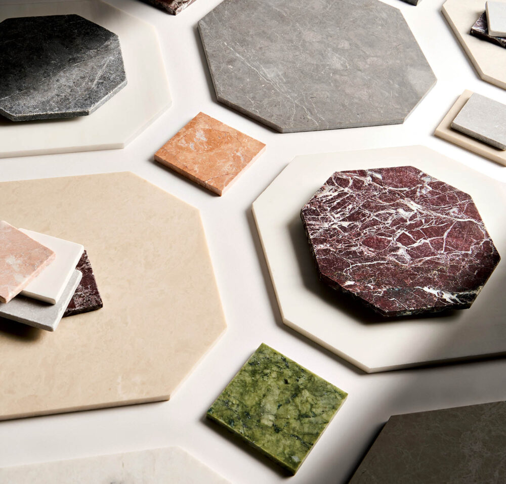 Assorted hexagonal and square marble tiles in various colors
