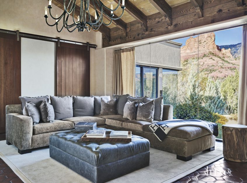 rustic sliding barn doors in masculine gray, brown and blue den