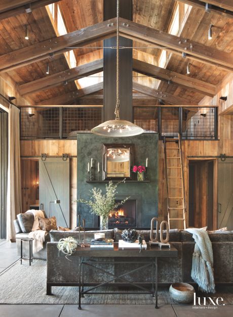 gray green barn doors in rustic wooden loft with two stories