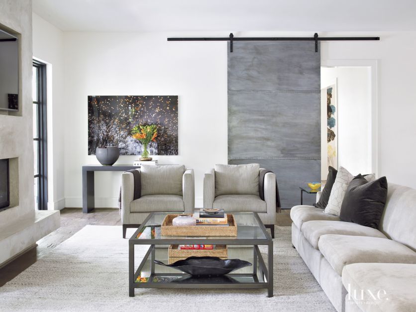 gray barn door in transitional light gray living area