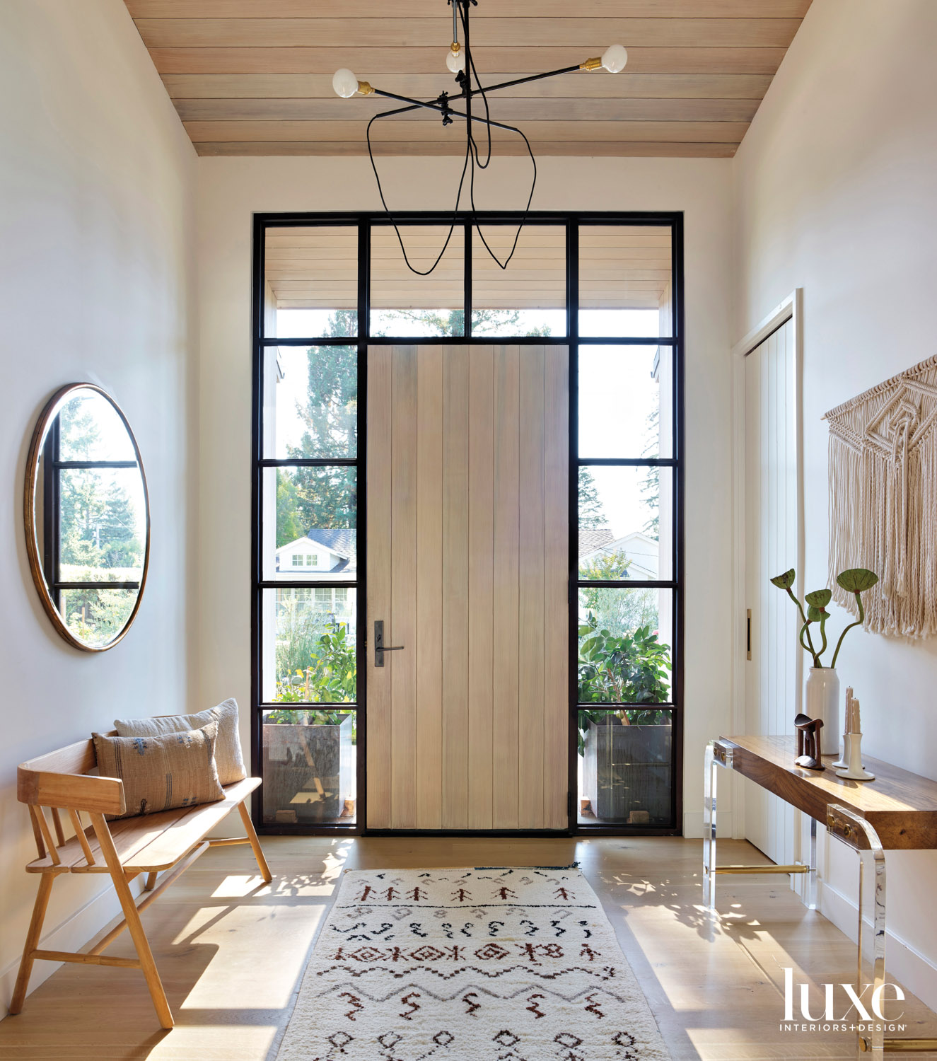 minimalist entry with front door and windows