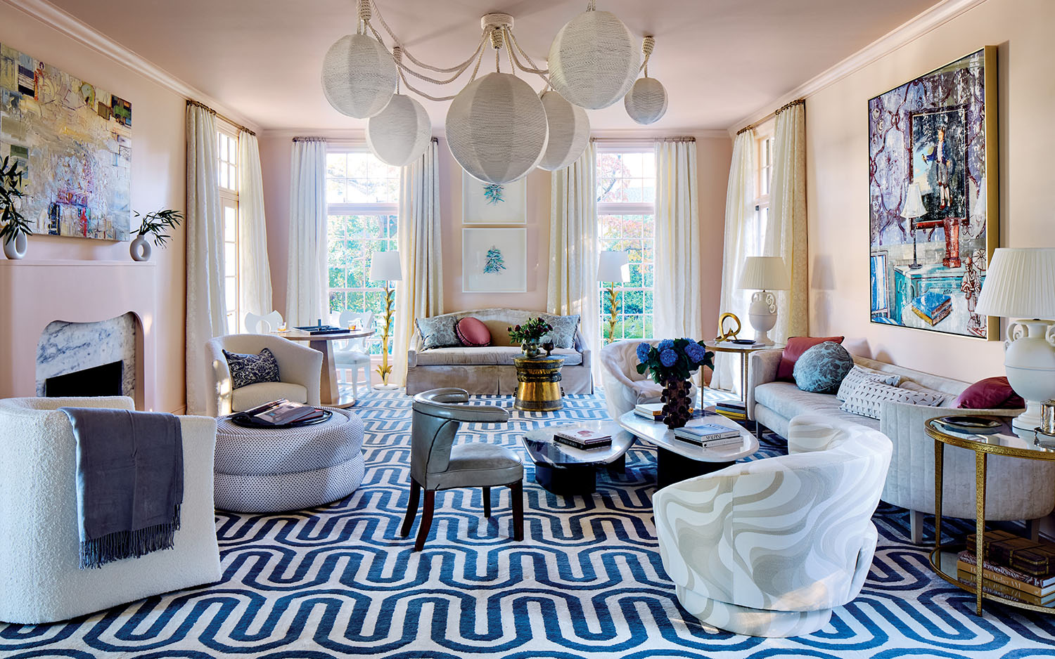 A cozy living room featuring a blue and white rug, enhancing the space's inviting atmosphere.